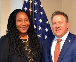 County Executive Daniel P. McCoy (right) with Evelyn A. Kinnah, Esq., Director of the Albany County Immigration Assistance Center